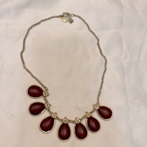 Pretty necklace accent for any outfit. Burgundy colored stones